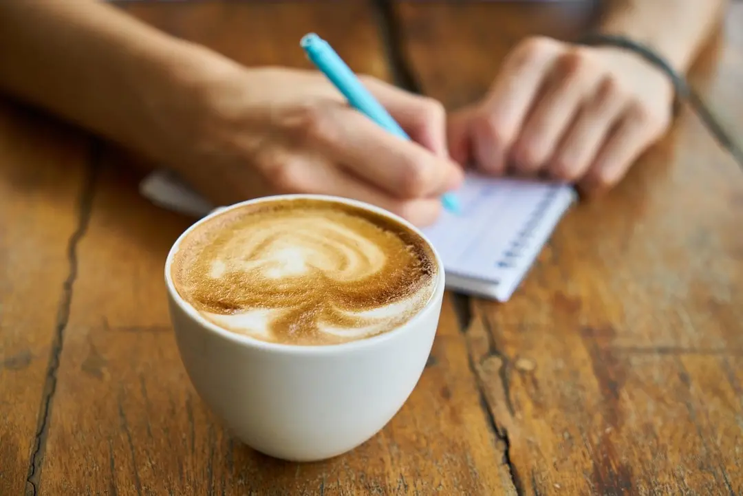 Writing a list next to a latte